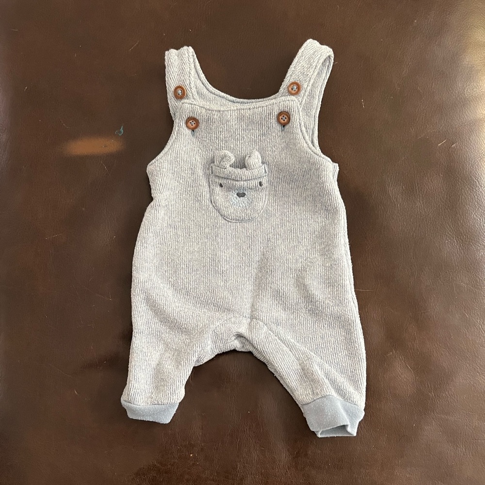 Gender neutral soft newborn sized overalls in light blue!
